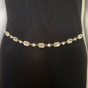 Gold tone metallic skinny chain belt with rhinestone details